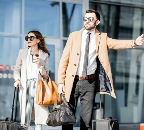 business-couple-catching-a-taxi-1.jpg